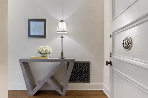 a view of dining room with wooden floor and dining table