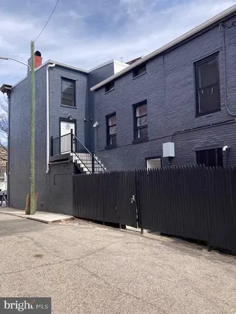 a bedroom with a bed and cabinets