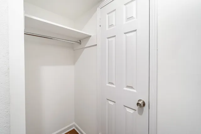 a bathroom with a glass shower door