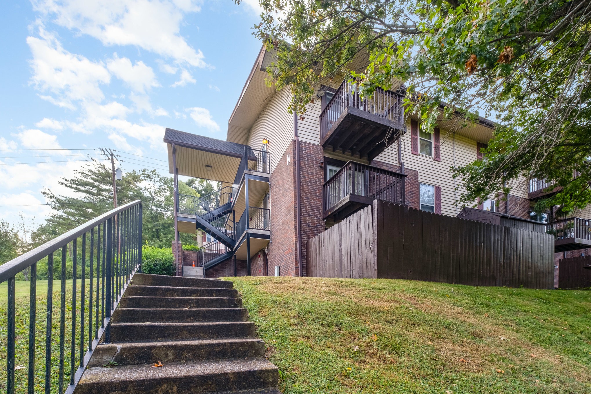 500 Paragon Mills Road, Unit N1 Nashville, TN 37211 - Photo 5 of 31 a view of a house with a yard