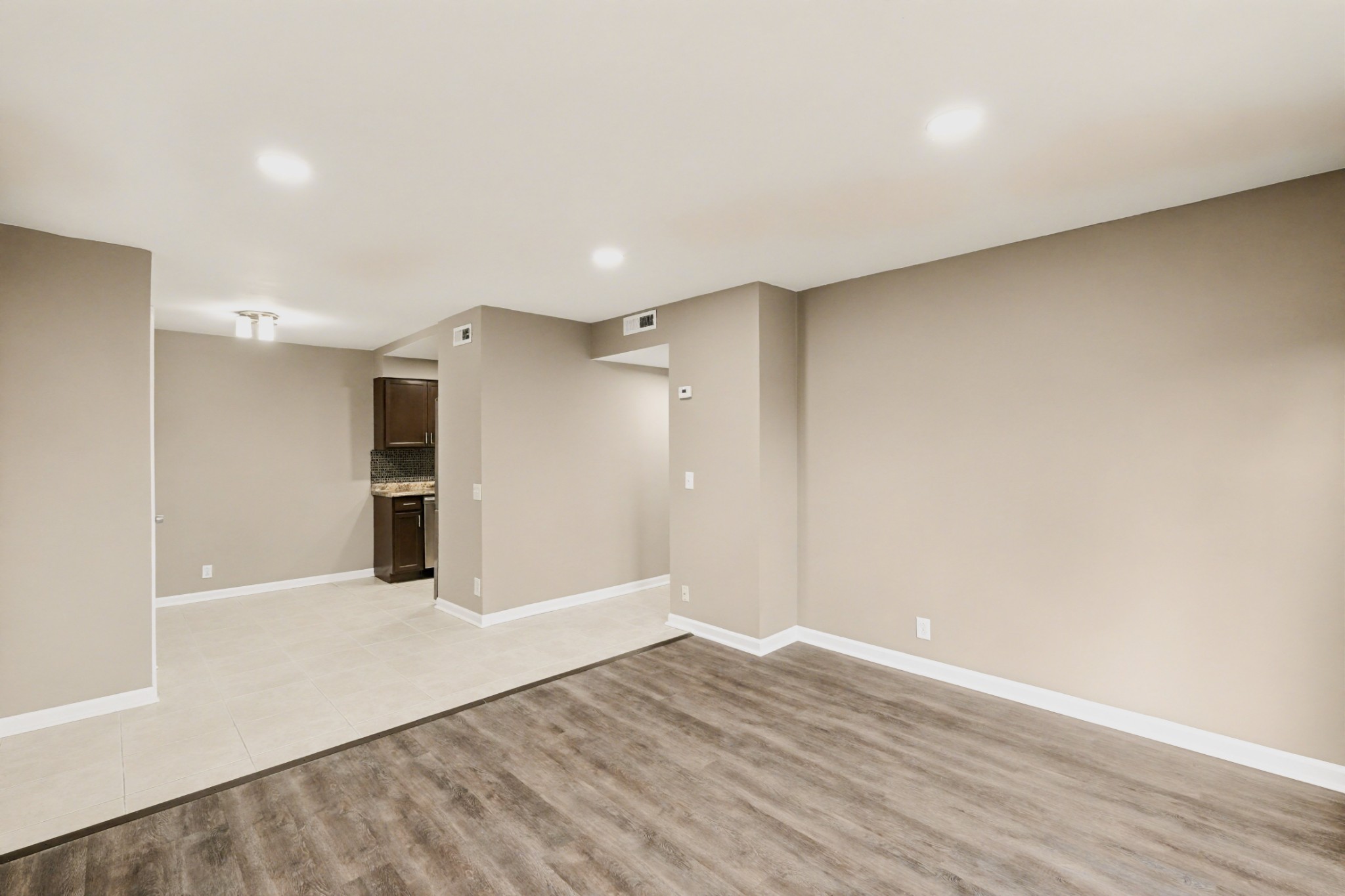 500 Paragon Mills Road, Unit N1 Nashville, TN 37211 - Photo 8 of 31 a view of an empty room with wooden floor and a window