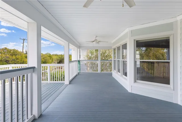 a view of a porch with wooden floor and outdoor space