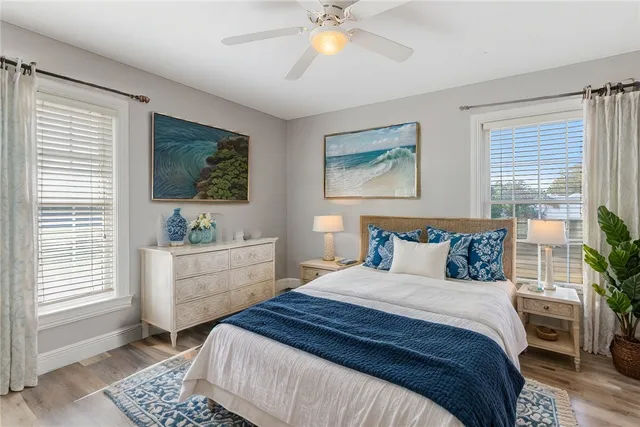 a bedroom with a large bed and a window