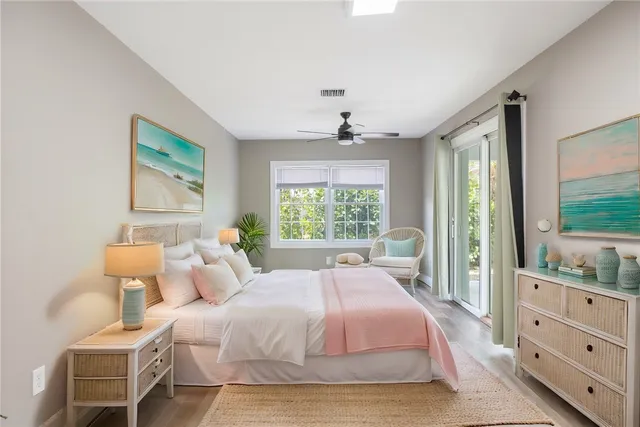 a spacious bedroom with a bed and a window