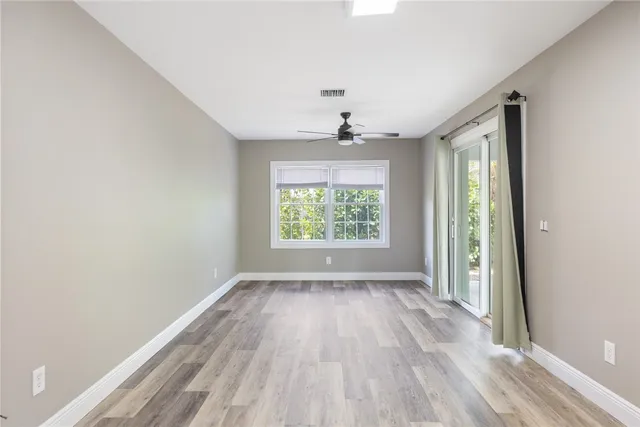 a view of room with window and hardwood floor