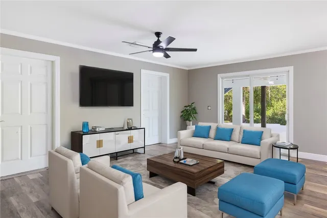 a living room with furniture and a flat screen tv