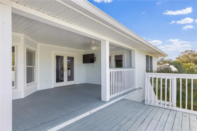 a view of a house with porch and wooden floor