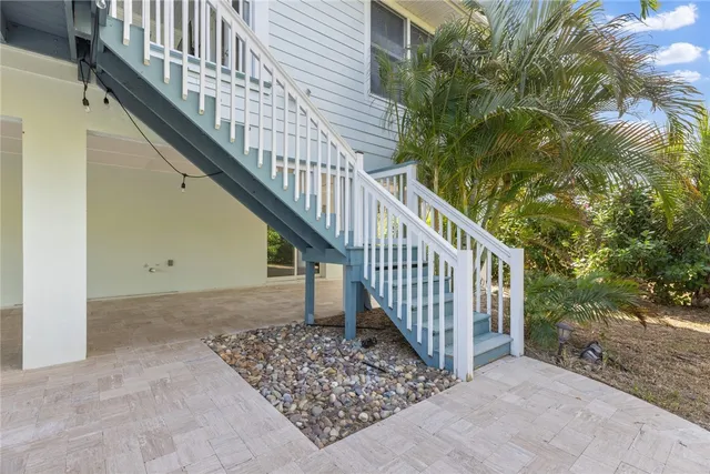 a view of staircase with wooden floor and fence