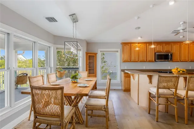 a view of a dining room with furniture window and outside view