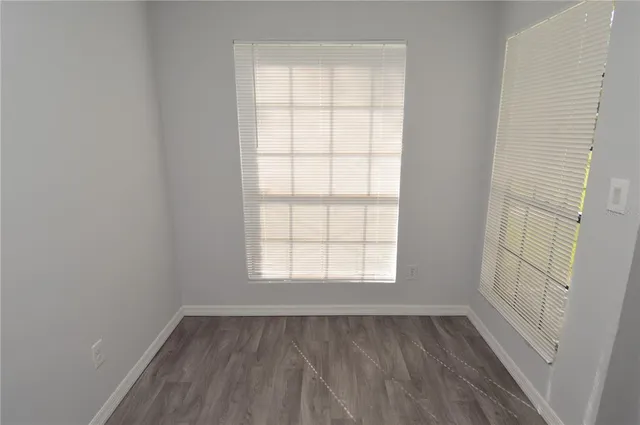 a white toilet sitting next to a bath tub