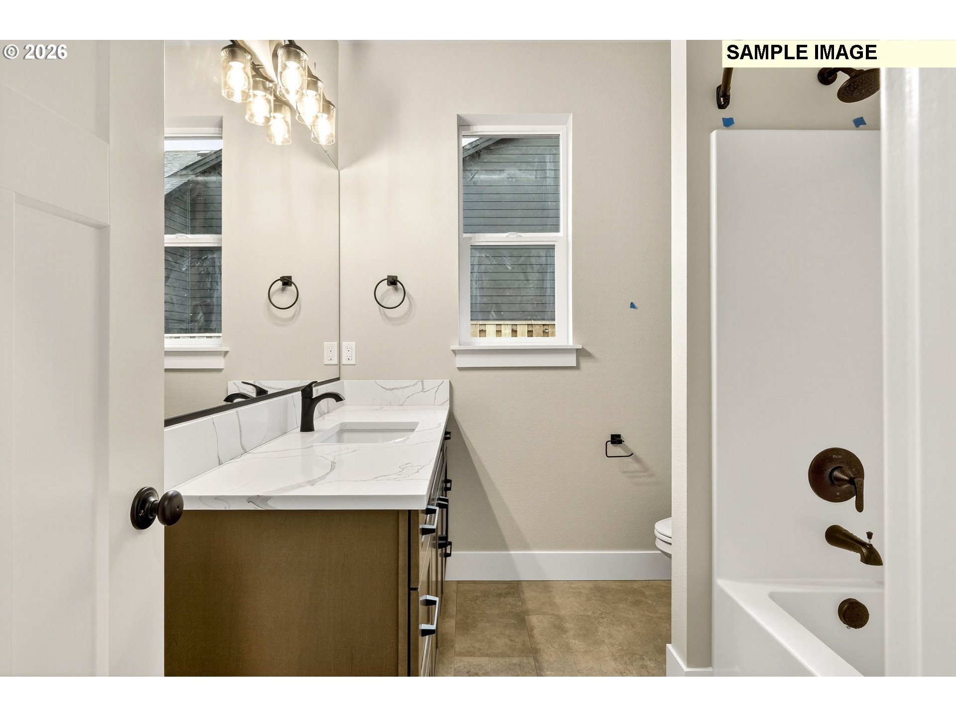 3352 Northeast Sweetwater Road, Unit 80 Estacada, OR 97023 - Photo 32 of 48 a bathroom with a tub sink and mirror