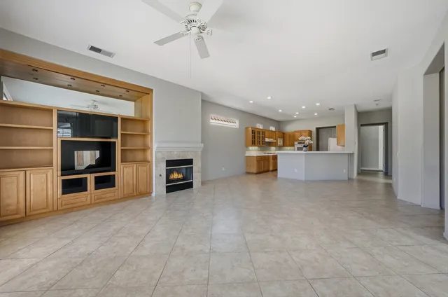 a view of a big room with closet and windows