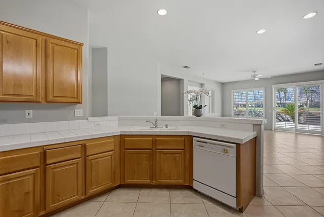 a kitchen with sink and cabinets