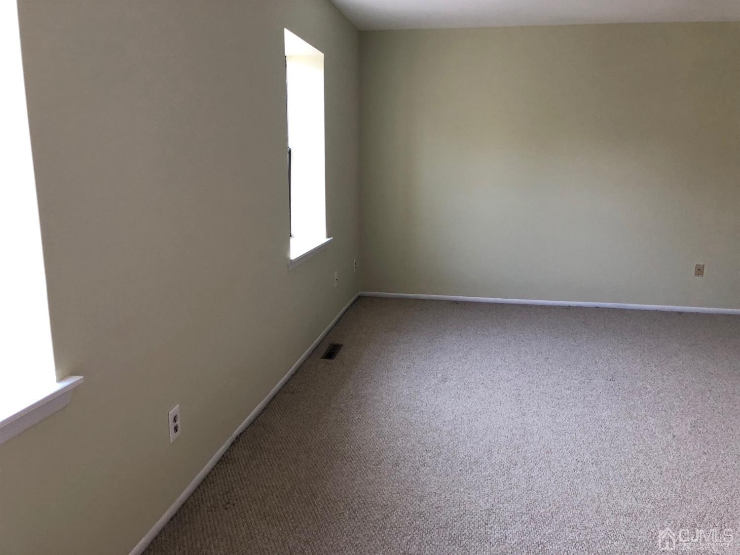 7706 Hana Road Edison, NJ 08817 - Photo 11 of 28 an empty room with a window