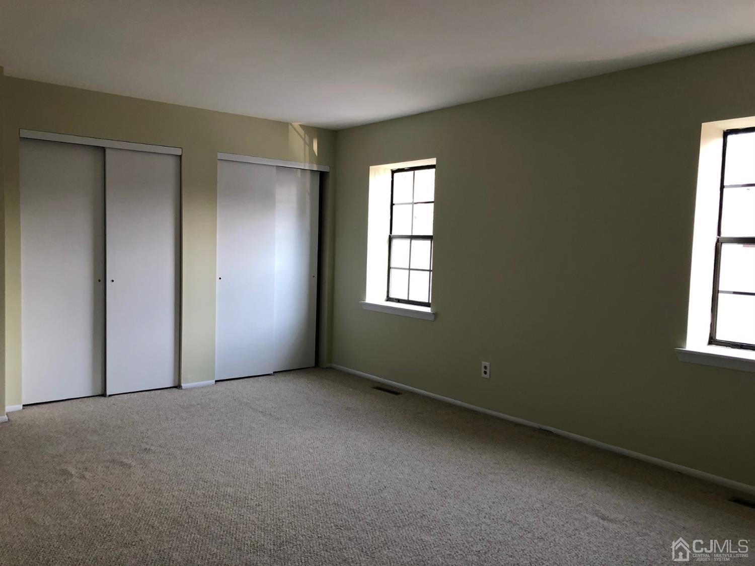 7706 Hana Road Edison, NJ 08817 - Photo 12 of 28 an empty room with windows