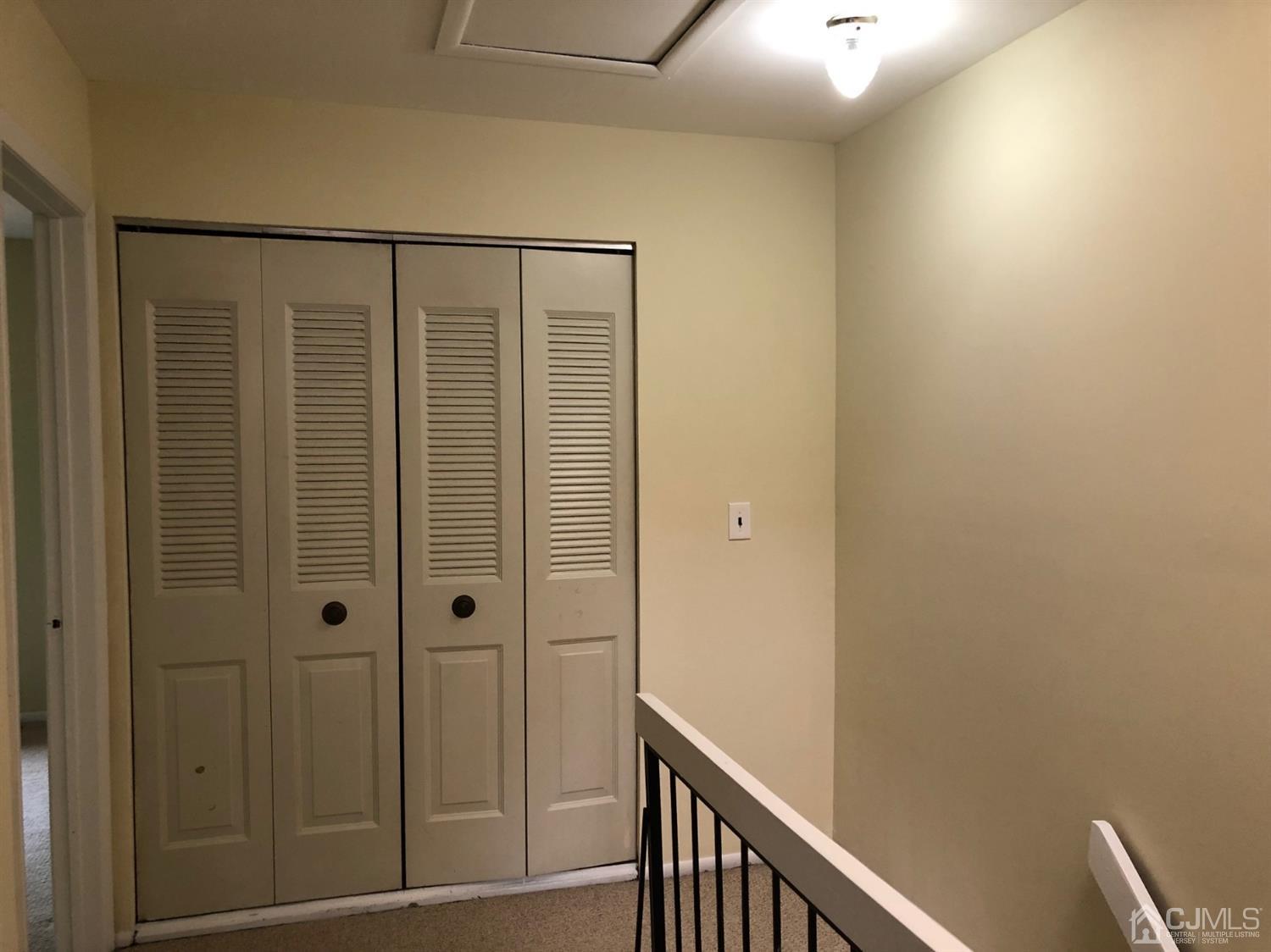 7706 Hana Road Edison, NJ 08817 - Photo 18 of 28 a view of a hallway