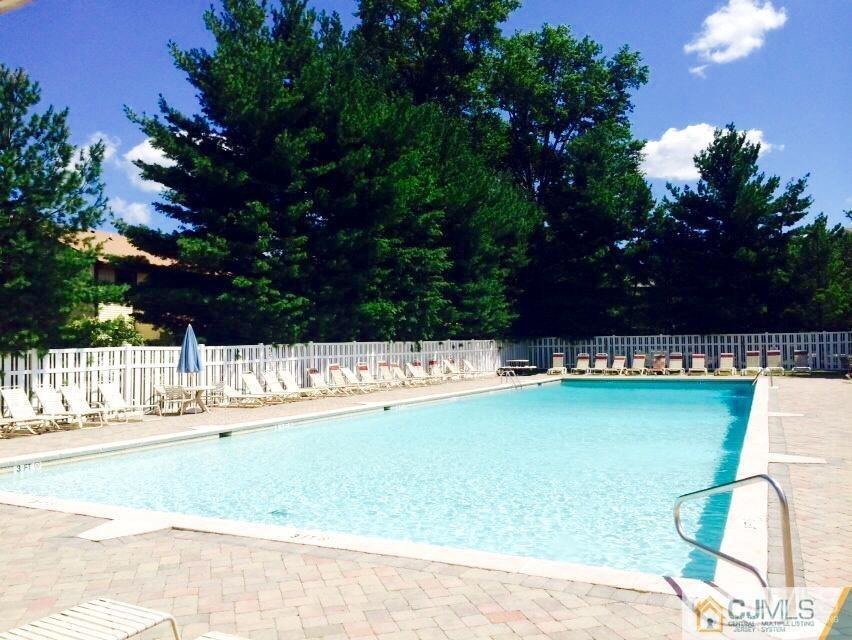 7706 Hana Road Edison, NJ 08817 - Photo 27 of 28 a view of swimming pool with an outdoor space