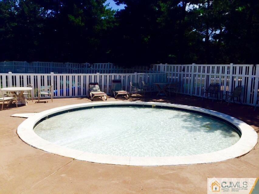 7706 Hana Road Edison, NJ 08817 - Photo 28 of 28 a view of swimming pool with outdoor seating