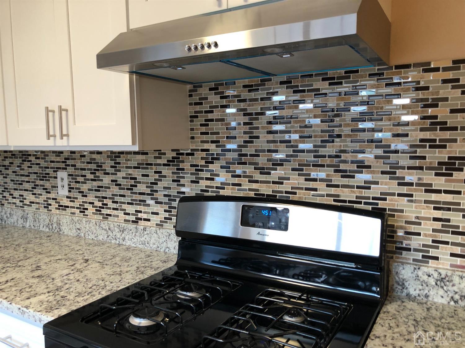 7706 Hana Road Edison, NJ 08817 - Photo 4 of 28 a close view of stove