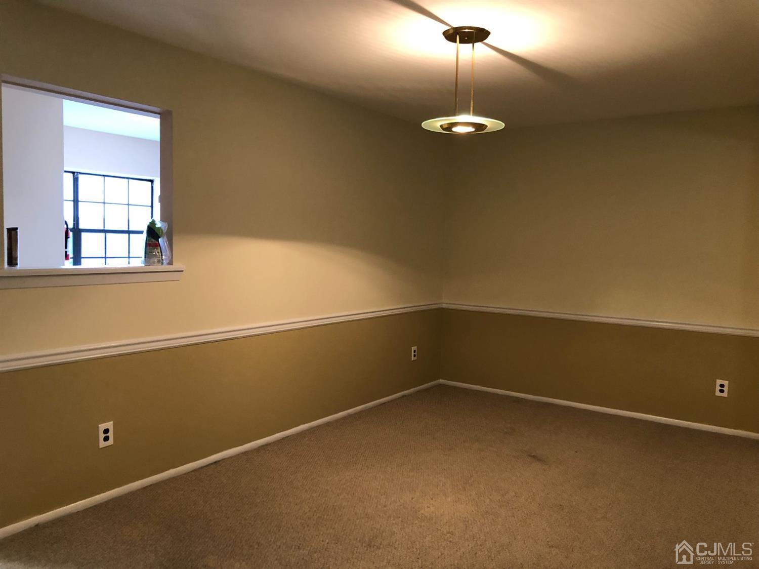 7706 Hana Road Edison, NJ 08817 - Photo 8 of 28 a view of a room with a fan