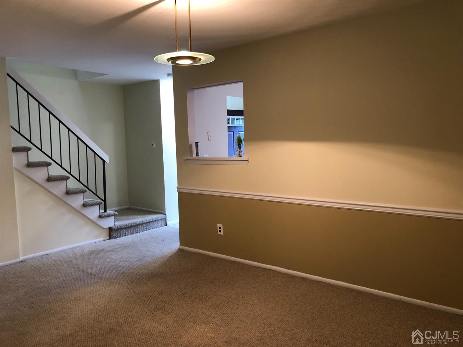 7706 Hana Road Edison, NJ 08817 - Photo 10 of 28 a view of an empty room with a window