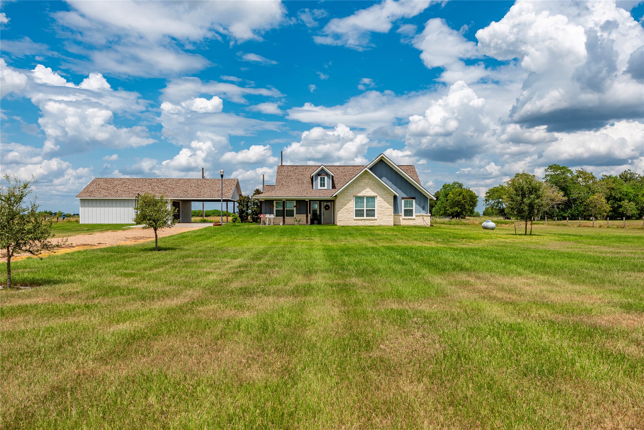a view of a house with a big yard