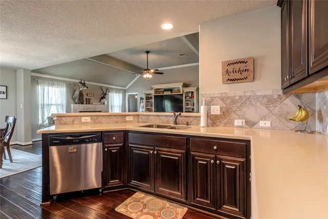 a kitchen with a sink and cabinets