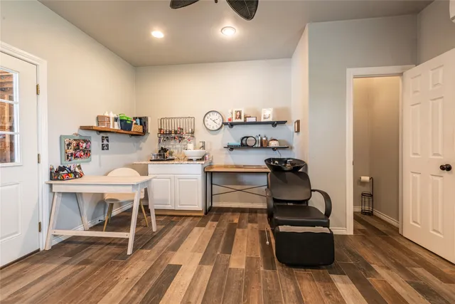 a room with wooden floor and furniture