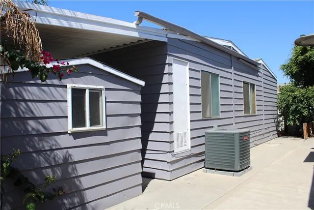 a kitchen with a refrigerator and a stove