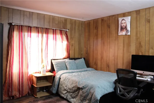 a bedroom with a bed and a table