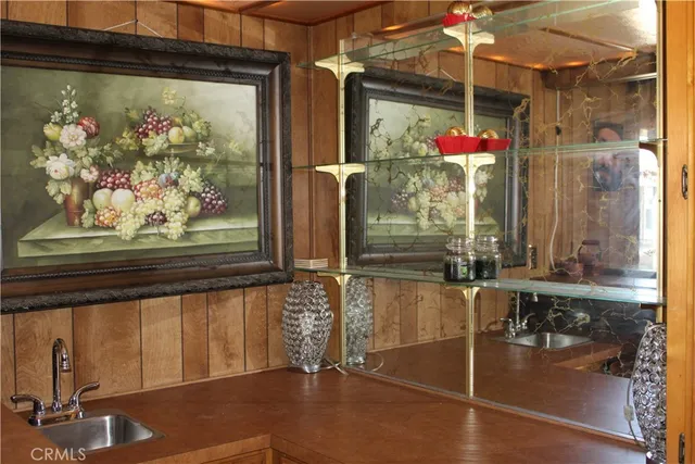 a room with water heater and wooden floor