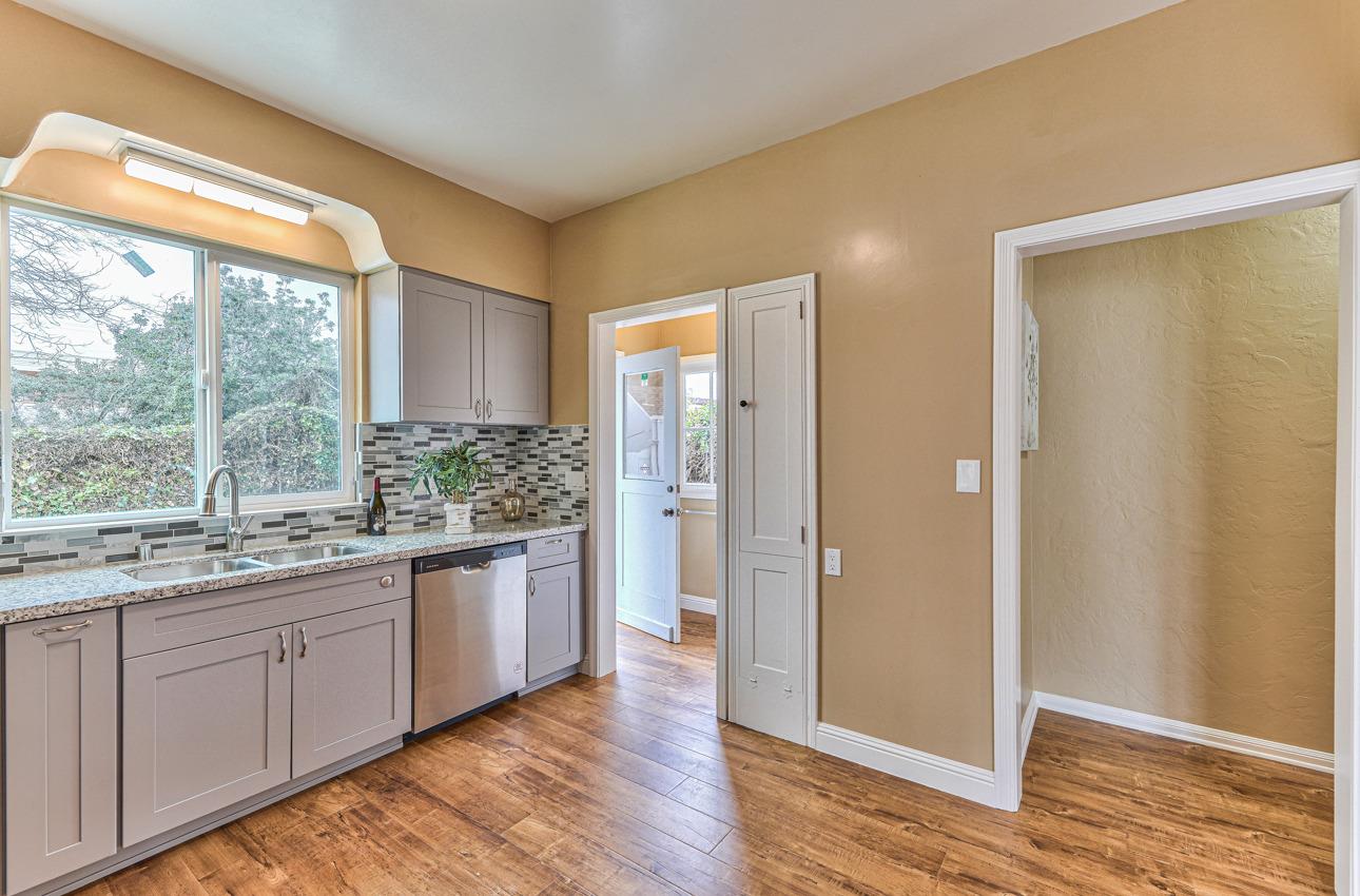 160 Lorimer Street Salinas, CA 93901 - Photo 18 of 45 a bathroom with a granite countertop sink and a large mirror