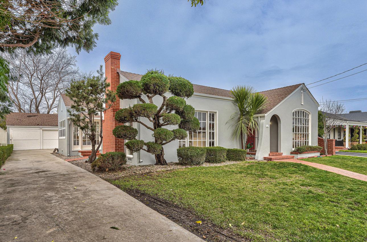160 Lorimer Street Salinas, CA 93901 - Photo 2 of 45 a front view of a house with a yard and potted plants