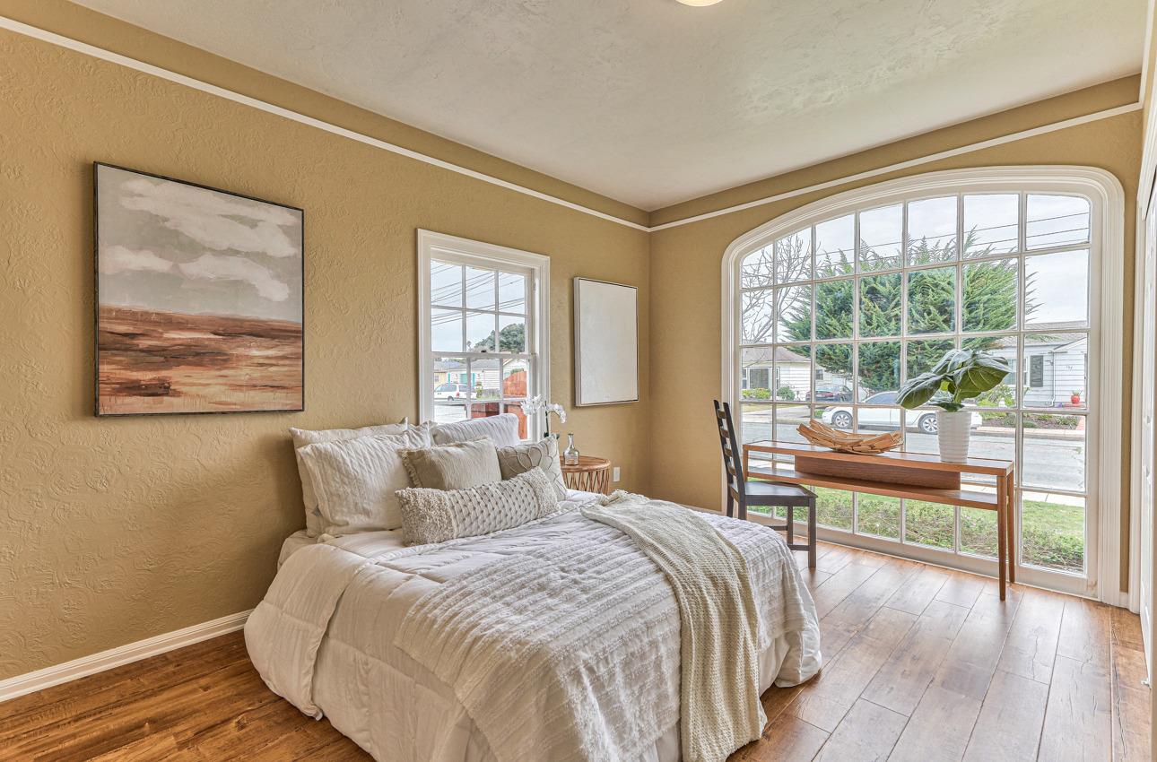 160 Lorimer Street Salinas, CA 93901 - Photo 23 of 45 a bedroom with a large bed and a balcony view