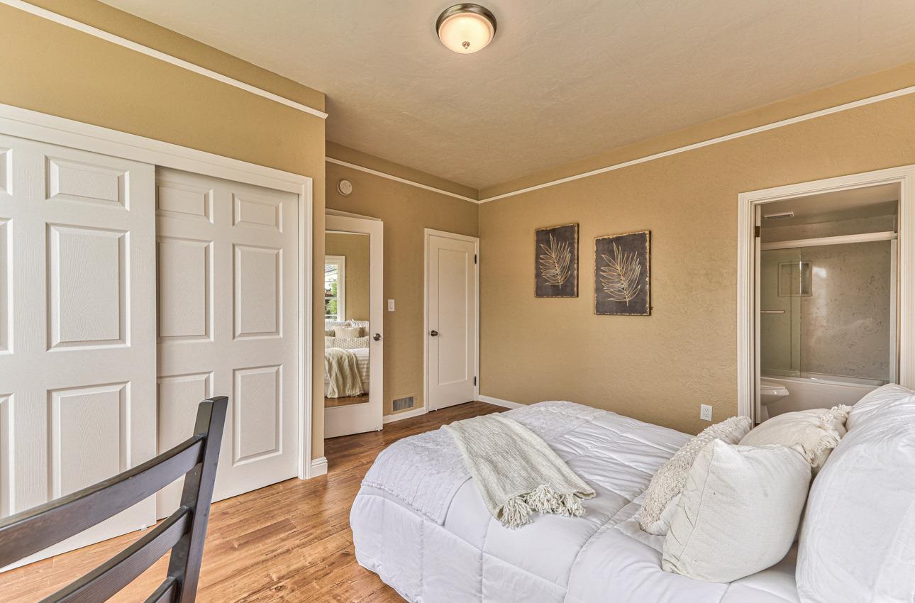160 Lorimer Street Salinas, CA 93901 - Photo 26 of 45 a bedroom with a bed and wooden floor