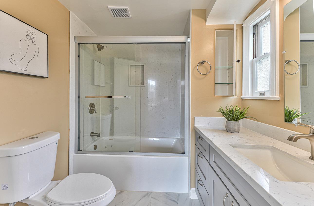 160 Lorimer Street Salinas, CA 93901 - Photo 28 of 45 a bathroom with a granite countertop sink toilet and shower
