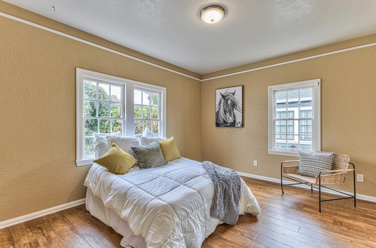 160 Lorimer Street Salinas, CA 93901 - Photo 29 of 45 a bedroom with a bed and wooden floor