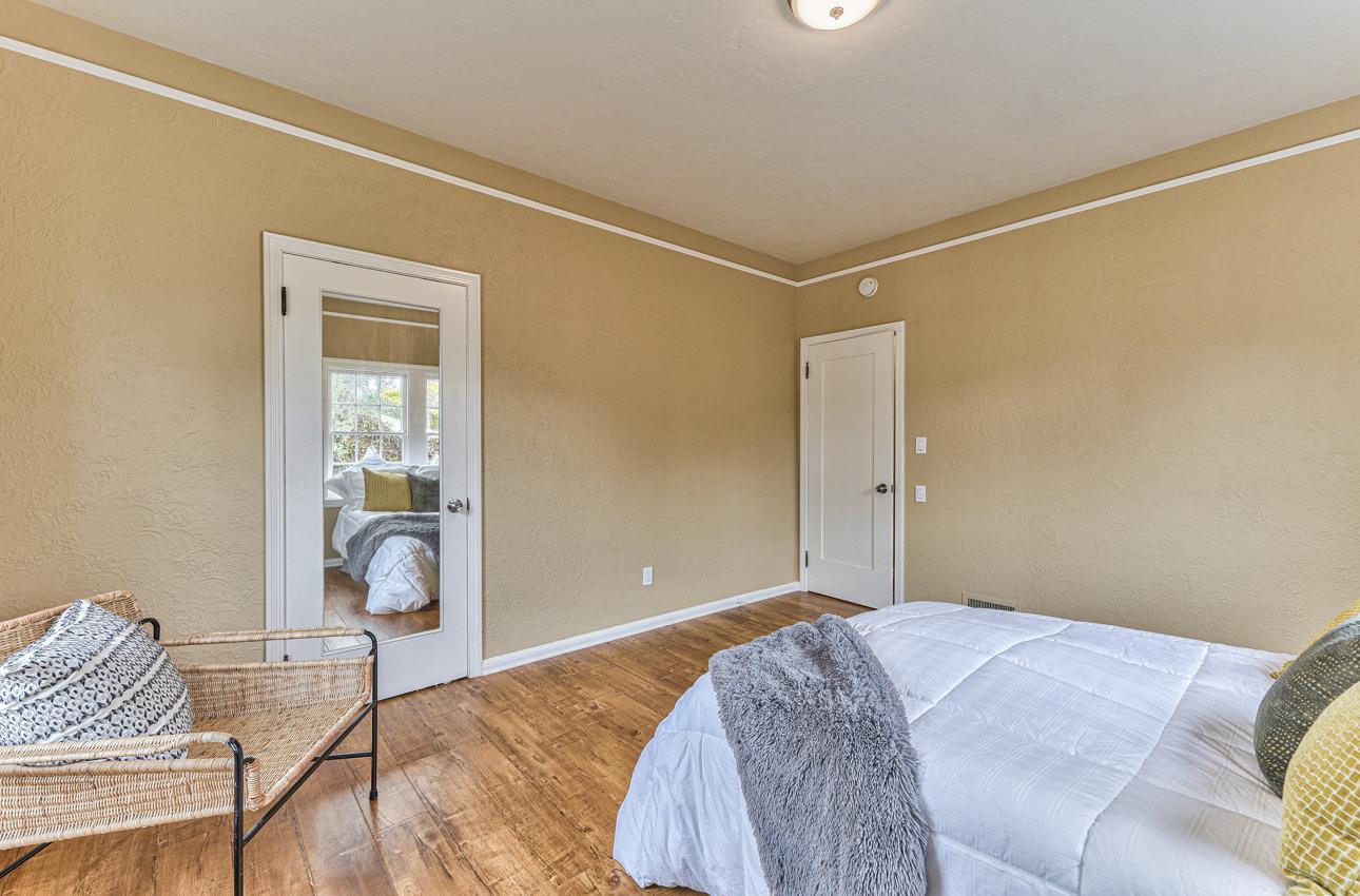 160 Lorimer Street Salinas, CA 93901 - Photo 30 of 45 a bedroom with a bed and wooden floor