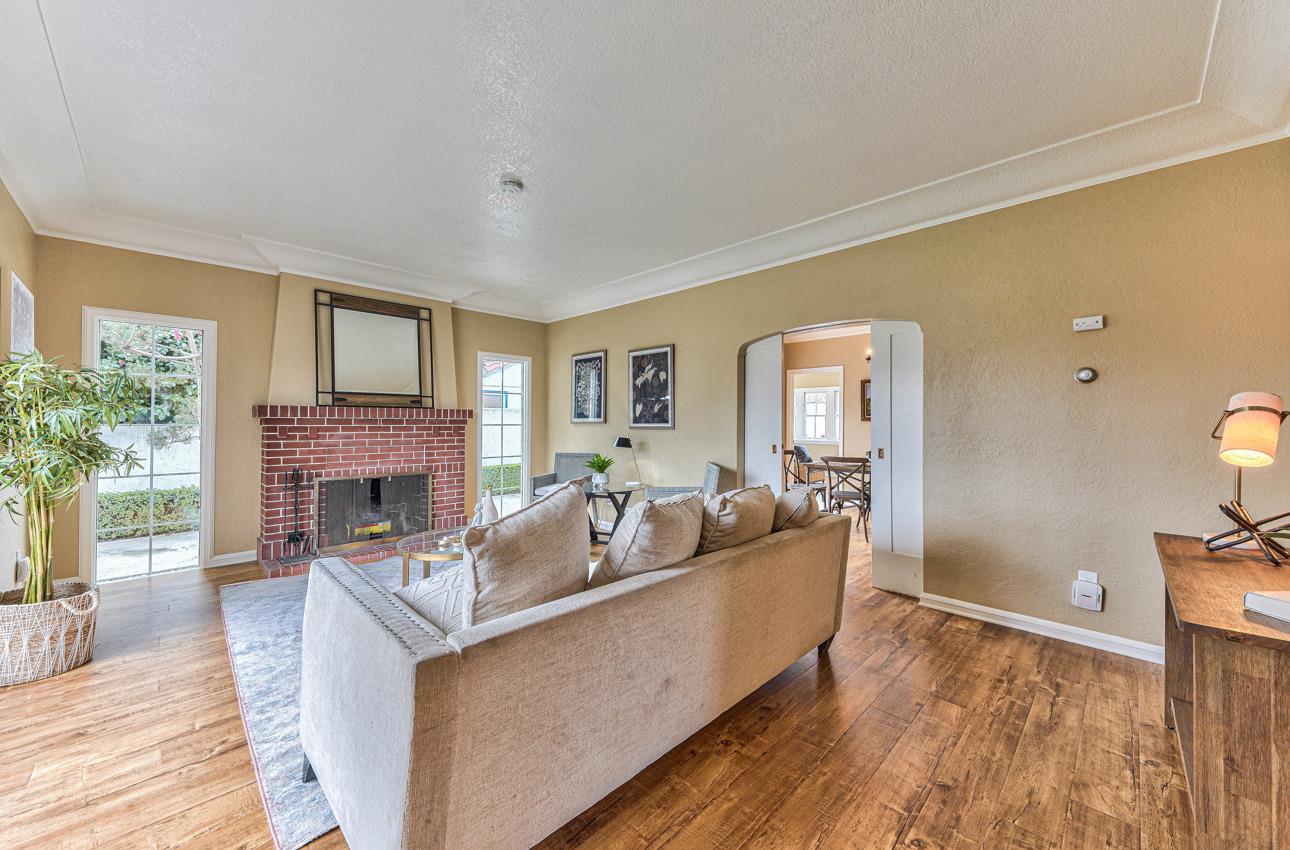 160 Lorimer Street Salinas, CA 93901 - Photo 7 of 45 a living room with fireplace furniture and a wooden floor