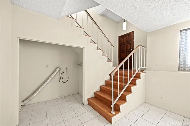 a view of entryway and hall with a floor to ceiling window