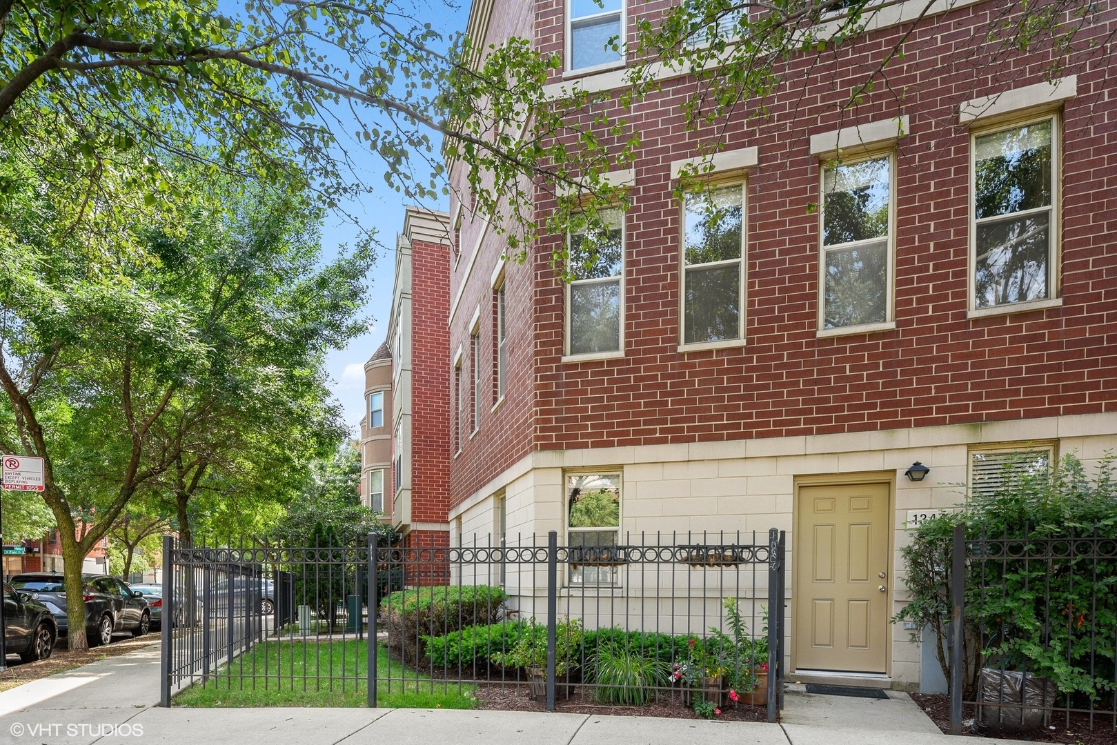 1344 North Burling Street Chicago, IL 60642 - Photo 1 of 21 a view of a brick building next to a yard