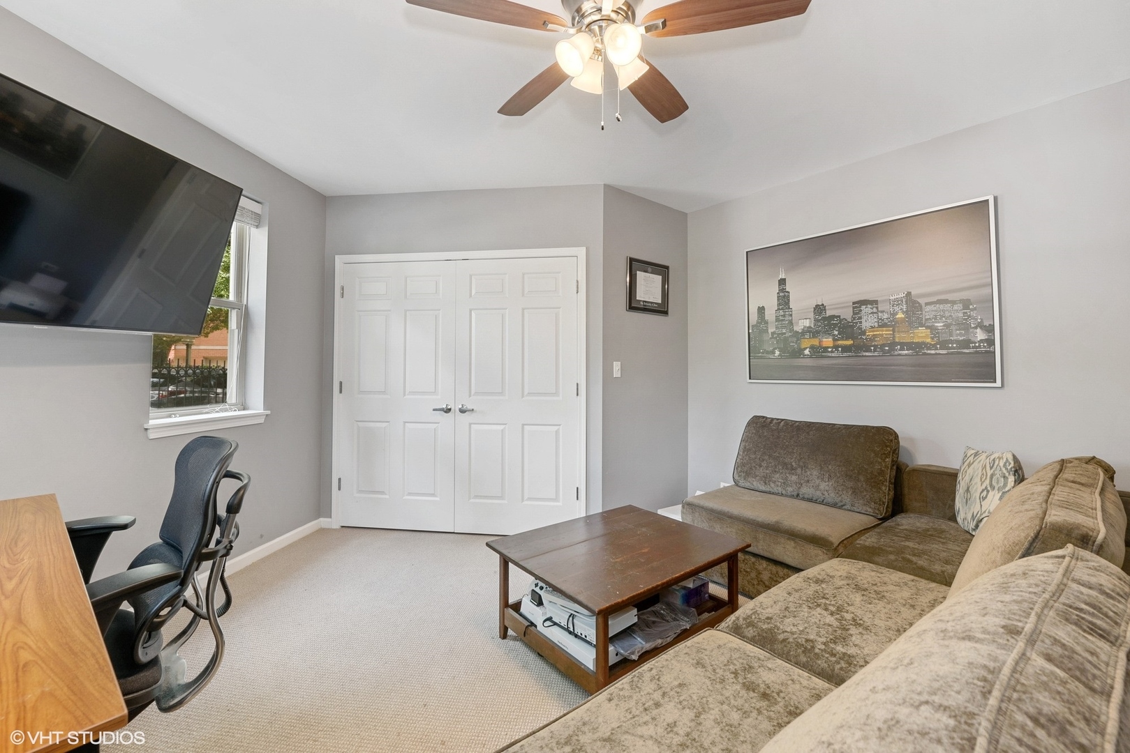 1344 North Burling Street Chicago, IL 60642 - Photo 12 of 21 a living room with furniture a flat screen tv and a window