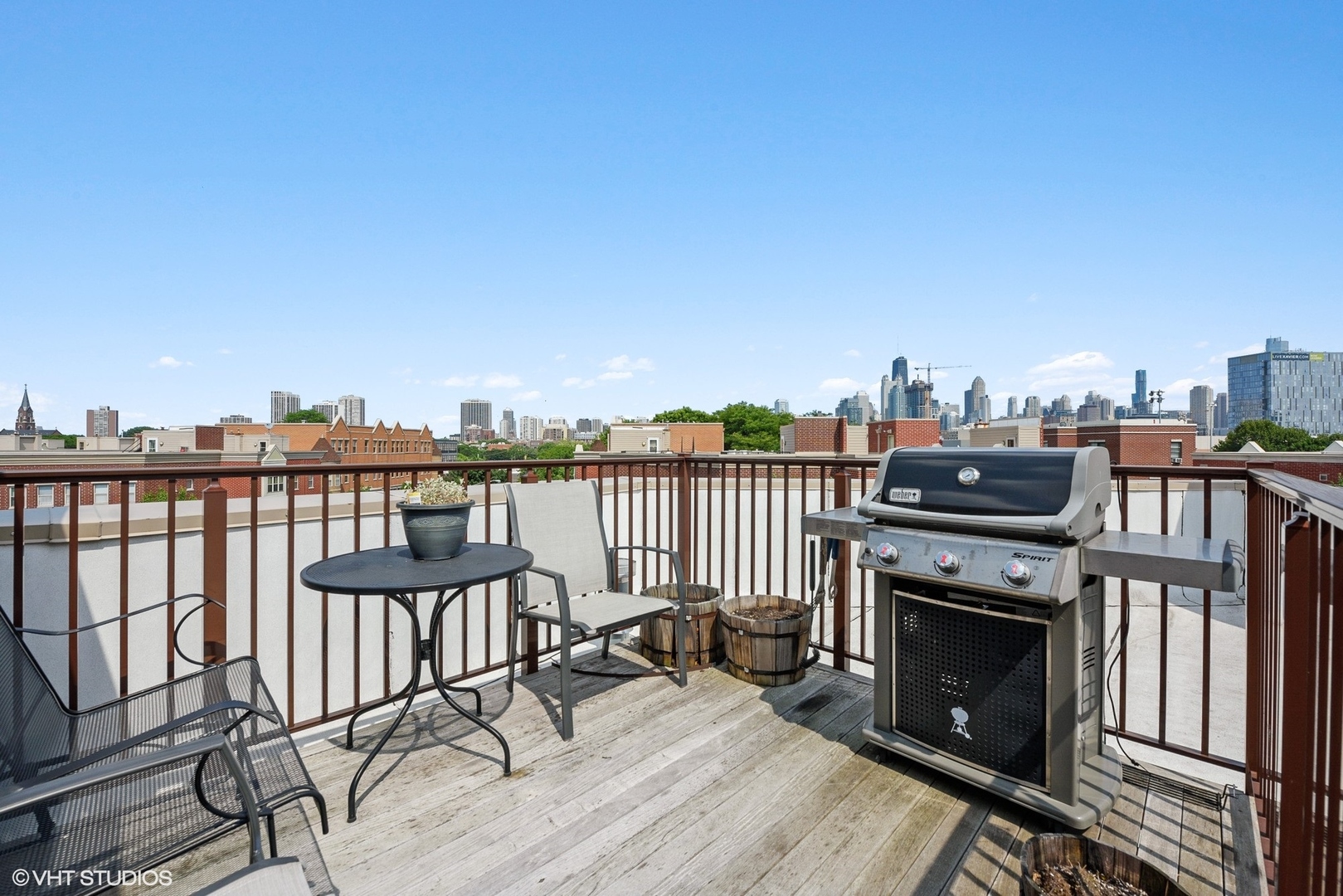 1344 North Burling Street Chicago, IL 60642 - Photo 14 of 21 a view of a balcony with wooden chairs
