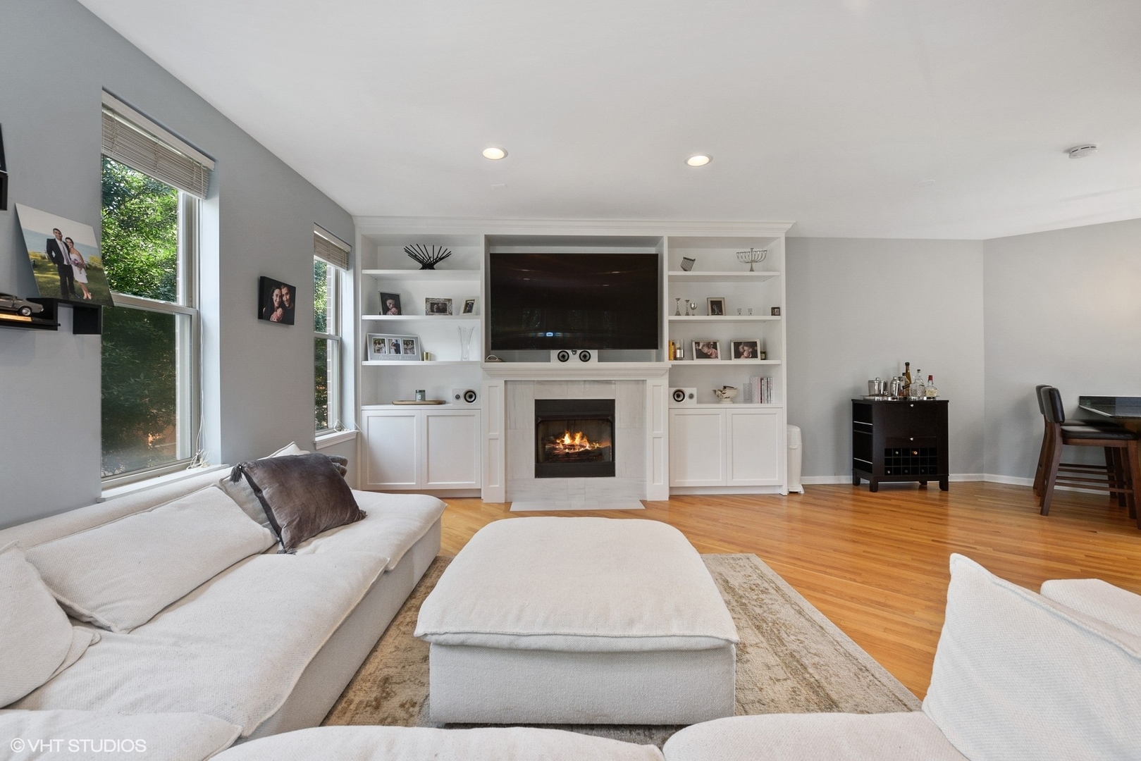 1344 North Burling Street Chicago, IL 60642 - Photo 3 of 21 a living room with furniture a flat screen tv and a fireplace