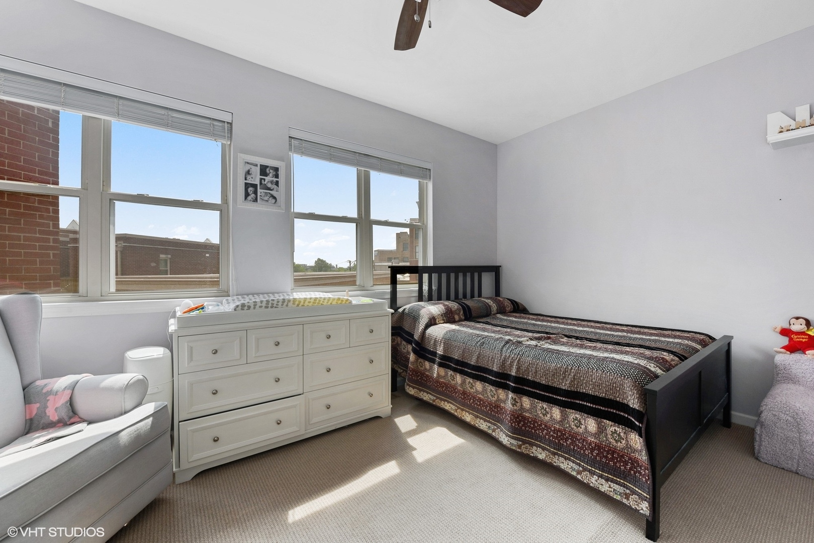 1344 North Burling Street Chicago, IL 60642 - Photo 10 of 21 a spacious bedroom with a bed and a window