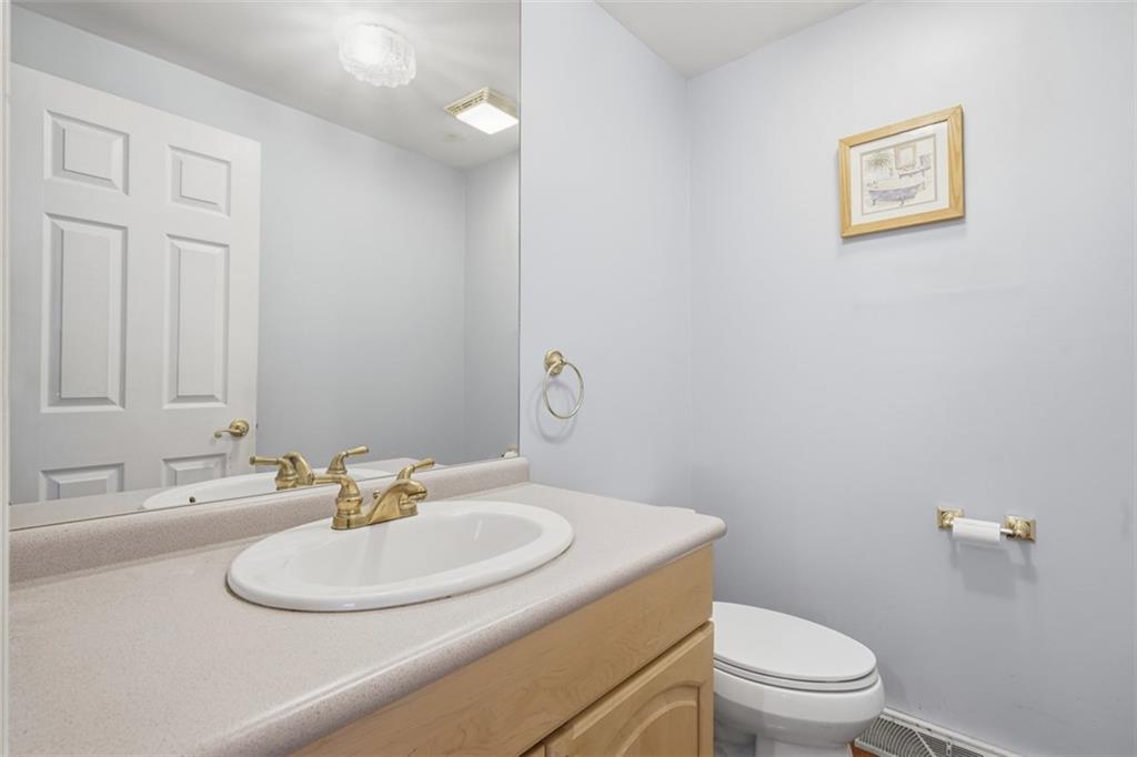 126 Leon Road Pittsburgh, PA 15220 - Photo 11 of 50 a bathroom with a sink a toilet and mirror