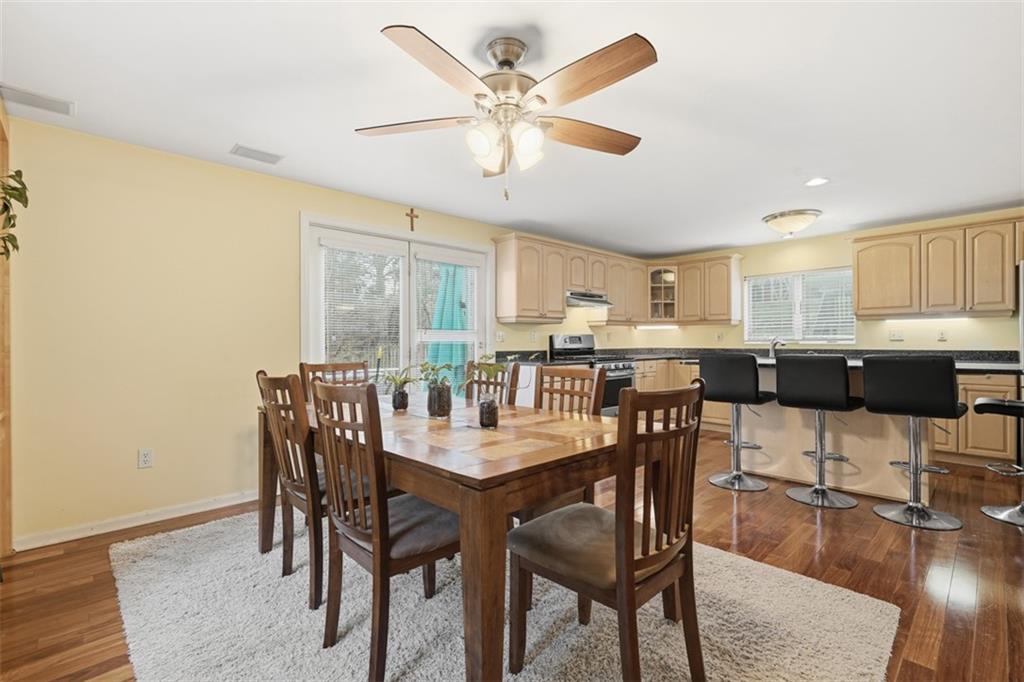 126 Leon Road Pittsburgh, PA 15220 - Photo 18 of 50 a view of a dining room with furniture and wooden floor