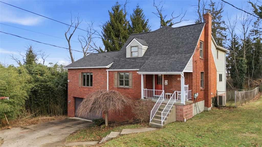 126 Leon Road Pittsburgh, PA 15220 - Photo 2 of 50 a view of a house with backyard and a tree