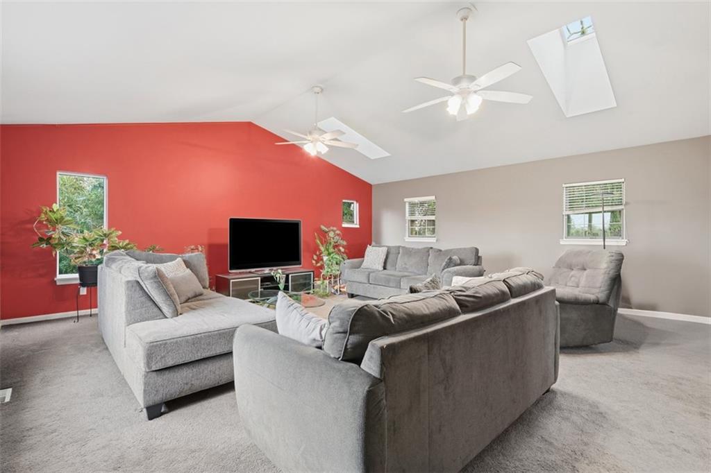 126 Leon Road Pittsburgh, PA 15220 - Photo 21 of 50 a living room with furniture window and a flat screen tv