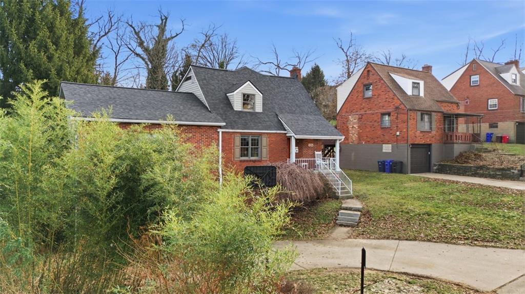 126 Leon Road Pittsburgh, PA 15220 - Photo 3 of 50 front view of house with a yard